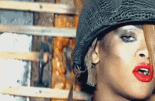 a close up of a woman wearing a military helmet
