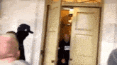 a group of people are standing in front of a door .