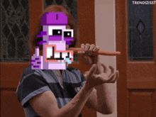 a pixel art of a woman brushing her teeth with a carrot in front of her face