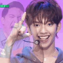 a man with a microphone in his ear is smiling in front of a purple background