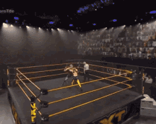 two women are wrestling in a ring with a crowd watching behind them and a sign that says infinity on it