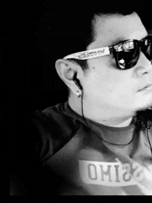 a man wearing sunglasses and a shirt that says ohio on it