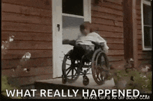 a person in a wheelchair is standing in front of a wooden building .