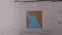 a person is holding a pen in front of a piece of paper with a triangle on it .