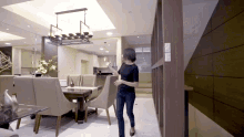 a woman in a black shirt is standing in a living room