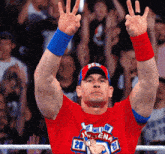 a wrestler wearing a red shirt that says cena 20
