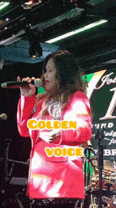 a woman singing into a microphone with the words " golden voice " on the bottom