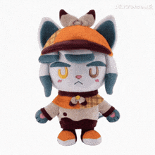 a stuffed cat wearing a hat and holding a sword