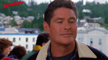 a man with the word baywatch written on the bottom