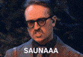 a man wearing glasses and a mustache says saunaaa