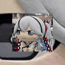 a stuffed doll with a ponytail is sitting in a room