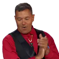 a man in a red shirt is clapping his hands
