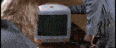 a white apple computer with an apple logo on the top