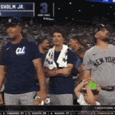 a man wearing a new york jersey stands in front of a crowd