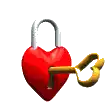 a heart shaped padlock with a key in it .