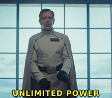 a man in a star wars uniform stands in front of a window with the words unlimited power written below him