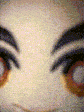 a close up of a person 's eyes with a blurred background