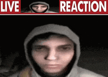 a picture of a man in a hoodie with the words live reaction below it