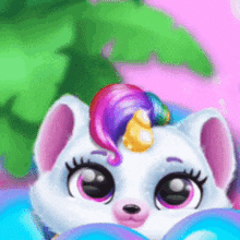a white unicorn with a rainbow mane and horn is looking at the camera .