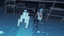 a person standing next to a robot that has the letter c on its head