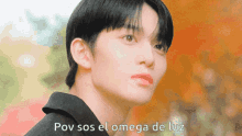 a close up of a person 's face with the words pov sos el omega de luz written below it