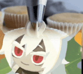 a cartoon character with red eyes is being decorated with icing