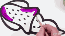 a person is drawing a whale with purple paint on a white background