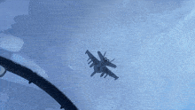 a fighter jet is flying through a clear blue sky .