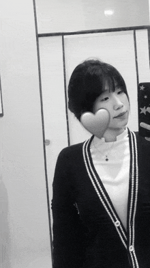 a woman taking a picture of herself in a mirror