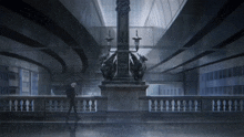 a man with an umbrella stands in front of a large statue
