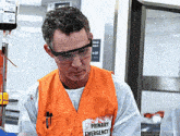 a man wearing a primary emergency vest