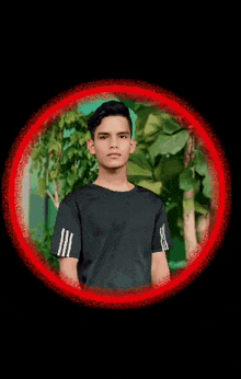 a boy in a black shirt stands in a red circle