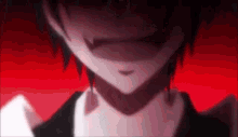 a close up of a person 's face with a smirk on his face .