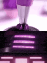 a close up of a person 's feet in purple shoes standing on a purple surface .