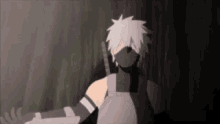 kakashi is wearing a mask and holding a sword .