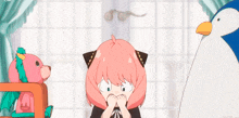 a little girl with pink hair is standing next to a stuffed animal and a penguin