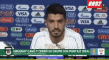 a soccer player is being interviewed on a television screen