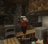 a screenshot of a minecraft game shows a character standing on a wooden table