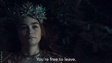 a woman with a crown on her head is saying you 're free to leave