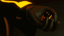 a close up of a person 's hand with a yellow light behind them
