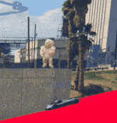 a stuffed animal is standing on a concrete wall with the words lo kana xl written on it