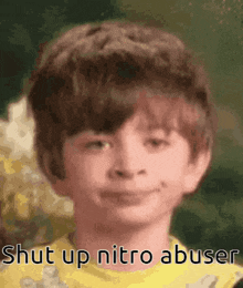 a close up of a child 's face with the words shut up nitro abuser