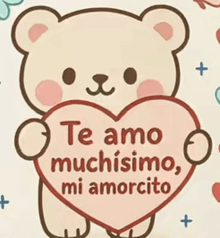 a teddy bear holding a heart with the words te amo muchisimo mi amorcito written on it