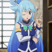 a girl with blue hair and a green bow pointing upwards