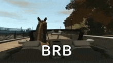 a dog is sitting in the driver 's seat of a car with the words brb written on the bottom .
