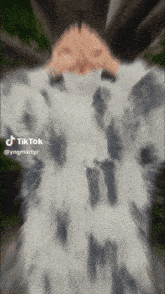 a blurred image of a person 's face with a tiktok watermark