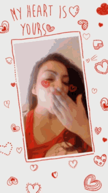 a woman blowing a kiss with the words " my heart is yours " on the bottom