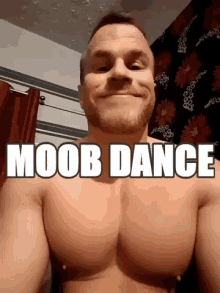 a shirtless man is smiling with the words moob dance written above his chest