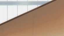 a staircase with a wooden railing and a window