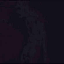 a dark purple background with a grunge texture and a few white spots on it .